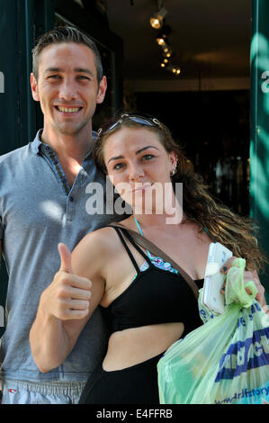 Couple, man and woman. Woman giving the thumbs up sign Stock Photo