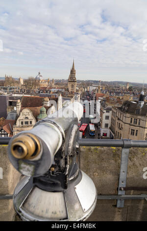 UK, Oxford, view from the top of the Carfax tower down the high street with a viewing telescope in the foreground. Stock Photo