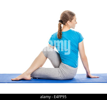 Fit woman doing ardha chandra chapasana yoga pose Stock Photo by Photology75