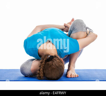 Yoga - young beautiful slender woman yoga instructor doing Forward Bends Sage Twist B pose (Marichyasana B) asana exercise Stock Photo