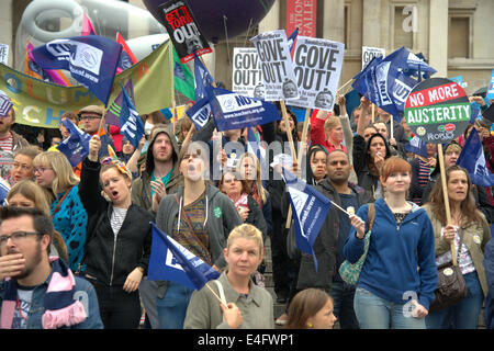 Trafalgar Square London UK 10th July 2014. Demonstrators shout and wave flags and banners as thousands of public sector workers protested against low pay in a day of action. After a procession through Central London the rally stopped in Trafalgar Square for a series of speeches by union officials. Credit Julian Eales/Alamy Live News Stock Photo