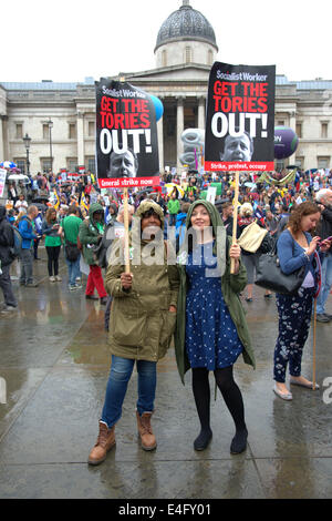 Trafalgar Square London UK 10th July 2014. Demonstrators shout and wave flags and banners as thousands of public sector workers protested against low pay in a day of action. After a procession through Central London the rally stopped in Trafalgar Square for a series of speeches by union officials. Credit Julian Eales/Alamy Live News Stock Photo