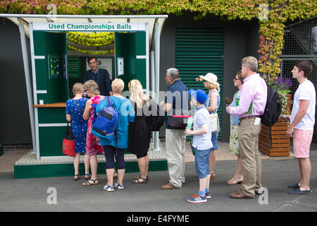 Spectators purchasing Used Championship Balls at  Wimbledon Tennis Championships 2014, Southwest London, England, UK Stock Photo