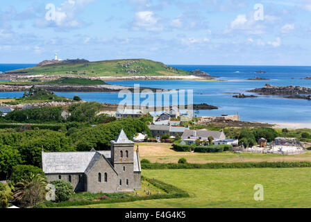 Tresco, Isles of Scilly, Cornwall England.  Looking towards Old Grimsby harbour with St Nicholas church in the foreground. Cornwall England UK. Stock Photo