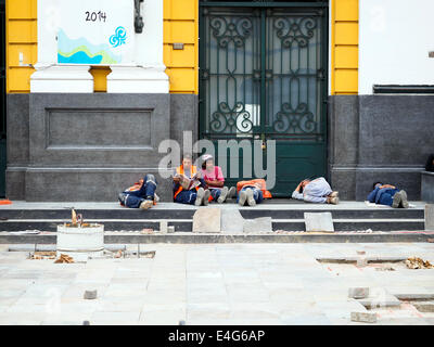 Workers resting near Casa de la Literatura Peruana (house of Peruvian Literature) - Lima, Peru Stock Photo