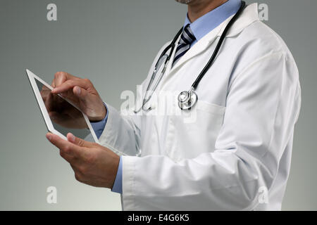 Doctor using digital tablet Stock Photo