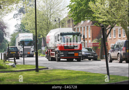 Traffic, parked and traveling through the rural Kent town of Tenterden, England Stock Photo