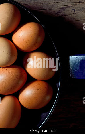 Whole brown egg in cast pan fried Stock Photo
