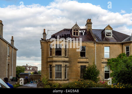 Bath, UK. 10th July 2014. Fire-fighters attend a fire at a late Victorian residential semi-detached house in Combe Park, Bath, just opposite the Royal United Hospital. The fire crew attended even though there was a public sector strike. Gas and Electricity workers were also on hand. Credit:  Paul Smith/Alamy Live News Stock Photo