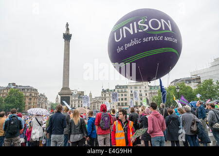 Trafalgar Square London UK 10th July 2014.  Protestors  in Trafalgar Square protest against low pay. Thousands of public sector workers held a one day strike and marched through London ending with a rally and speeches in Trafalgar Square.  Credit Julian Eales/Alamy Live News Stock Photo