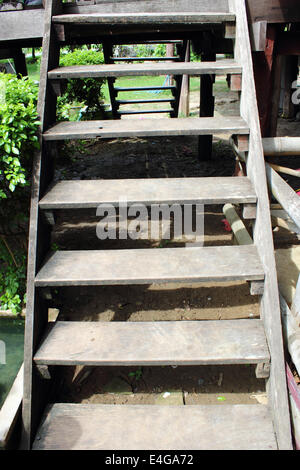 Old wooden stairs thai style Stock Photo