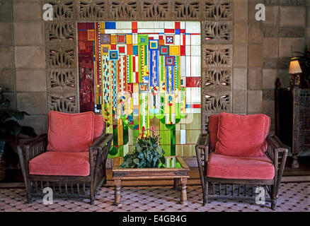 This colorful 1970s stained-glass window by architect Frank Lloyd Wright greets guests at the Arizona Biltmore Hotel & Spa in Phoenix, Arizona, USA. Stock Photo