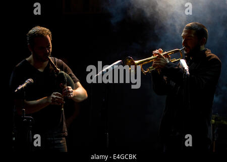 French trumpet player Ibrahim Maalouf (right) performing with a bagpipes player at Torino Jazz Festival. Stock Photo