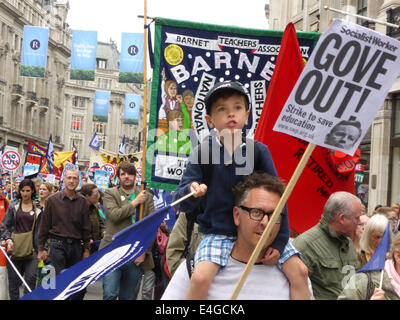 London, UK. 10th July, 2014. Public sector workers and their families march toward Trafalgar Square during a day of strike action to demonstrate against government policies on pay, pensions and cuts in services.  Over a million union members across the country were estimated to have taken industrial action to protest against the Government's austerity measures. Credit:  Deborah Roberts/Alamy Live News Stock Photo