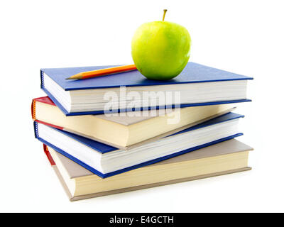 Stack of textbooks with apple and pencil on top, over white Stock Photo