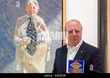 AUSTRALIA, Sydney : AUSTRALIA, Artist Tim Storrier with Storrier's Archibald Packing Room Prize winning portrait of Sir Les Patterson on July 10, 2014. Sir Les Patterson is a fictional character created and performed by comedian Barry Humphries. Stock Photo