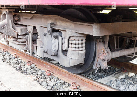 closeup wheel break and suspension system of diesel train Stock Photo