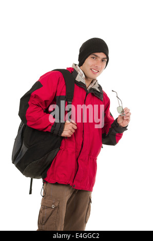 young man wearing red winter coat holding sunglasses Stock Photo