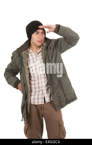 latin young man wearing green winter coat and a beanie Stock Photo