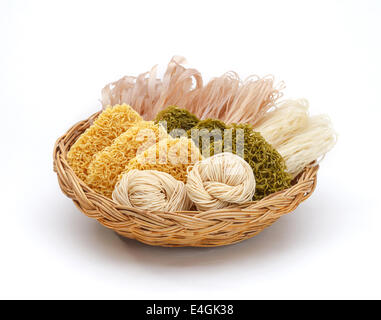 Dried noodles in the basket isolated on white background Stock Photo