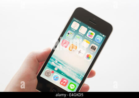 Coquitlam BC Canada - July 02, 2014 : Apple iPhone in a female hand, the iPhone is one of the most popular smart phones in the w Stock Photo