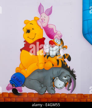 Winnie the Pooh illustration on a fairground ride at Whitby, North Yorkshire, UK. Stock Photo