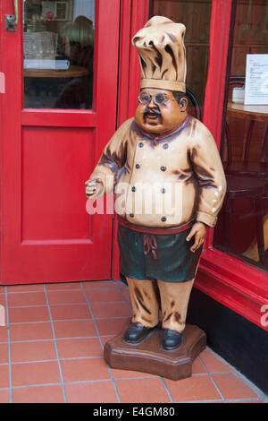 Model chef outside a cafe in Whitby, North Yorkshire, UK. Stock Photo