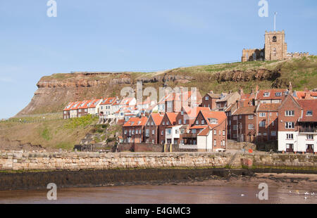 View of Whitby harbour showing the cliffs above the town and the church. Stock Photo