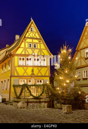 Famous half timber house in Rothenburg ob der Tauber by night, Germany Stock Photo