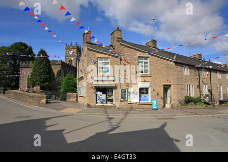 Village store and St Matthew's Church in Hayfield, Derbyshire, England, UK. Stock Photo