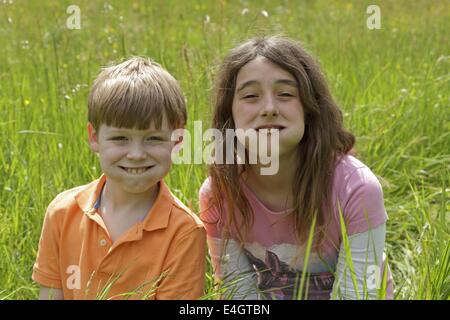 two children making grimaces Stock Photo