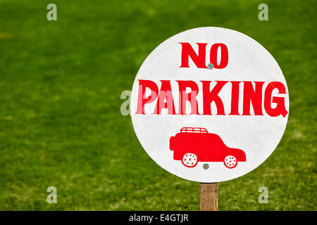 No parking sign on green lawn Stock Photo
