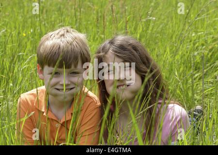 two children making grimaces Stock Photo