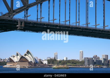 Sydney's icons, harbour bridge,opera house and Sydney ferry on a blue sky day,NSW,Australia Stock Photo