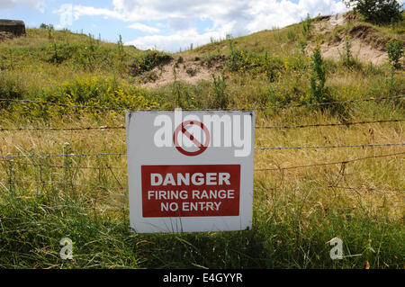 MOD danger firing range no entry sign on barbed wire Pendine Wales UK ...