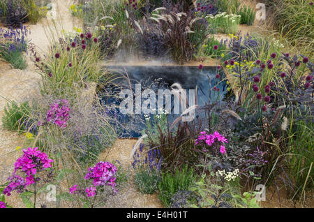 Steam rising in The One Show Garden at RHS Hampton Court palace Flower Show 2014 Stock Photo