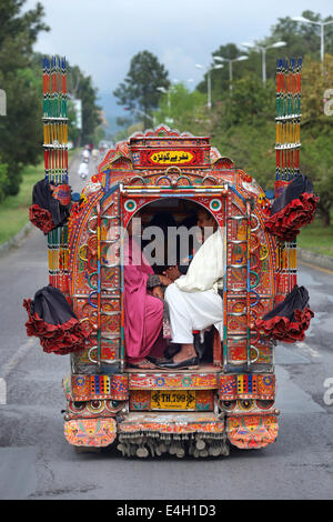 Pakistan, Islamabad, passengers in a decorated minibus, public transport Stock Photo