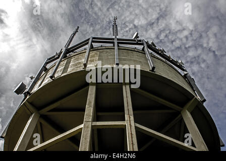 A Water Tower With Mobile Phone Antennas Attached Stock Photo