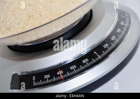 close up of a kitchen scale with rice, full frame Stock Photo
