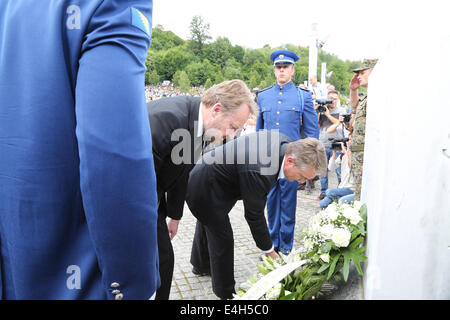 (140712) -- SREBRENICA, July 12, 2014 (Xinhua) -- Bosnia and Herzegovina (BiH) Chairman of Presidency Bakir Izetbegovic (2nd L) and BiH presidency member Zeljko Komsic (3rd L) lay a wreath during a funeral in Potocari, near Srebrenica, Bosnia and Herzegovina, July 11, 2014. The funeral of 175 recently identified victims was held here Friday to commemorate the 19th anniversary of the Srebrenica massacre. Some 7,000 Muslim men and boys were massacred in and near Srebrenica by Bosnian Serb forces in July 1995, the worst massacre in Europe since the end of World War II. (Xinhua/Haris Memija) (zjl) Stock Photo