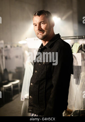 German fashion designer Michael Michalsky poses outside his new