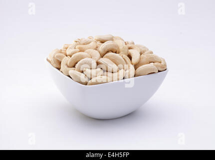 Cashew nuts in a bowl isolated on white background Stock Photo