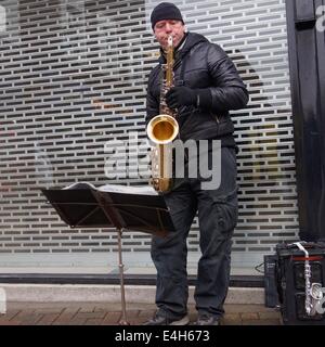 Scenes from Altrincham Market: The saxophonist Stock Photo