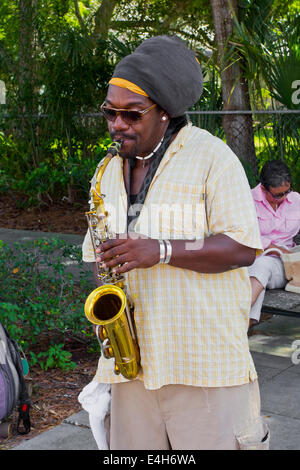 Male African American Saxophone street musician playing  music Stock Photo