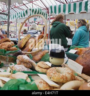 Scenes from Altrincham Market:Farmers' Maarket - stall holders pause for a chat Stock Photo