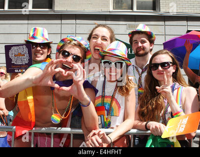 Spectators display support at 45th annual New York City Gay Pride Parade on Fifth Avenue in New York City. Stock Photo