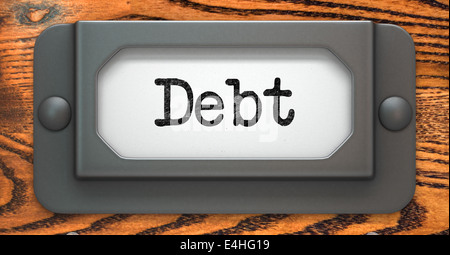 Debt - Concept on Label Holder. Stock Photo