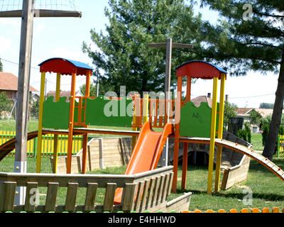 cheerful children's playground is located in a wooden board Stock Photo