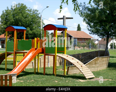 cheerful children's playground is located in a wooden board Stock Photo