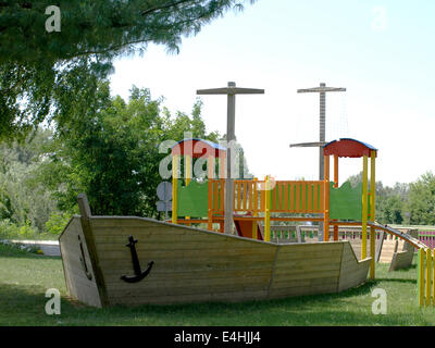 cheerful children's playground is located in a wooden board Stock Photo